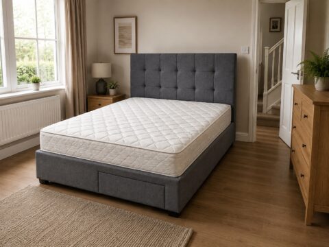 Grey upholstered bed with a cream mattress in a bright modern bedroom, representing bed disposal in Newbury.